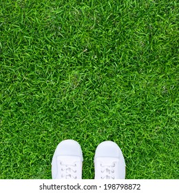 Standing On A Grass In White Shoes