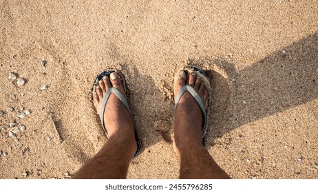 standing on the sand wearing sandals, Malang, April 30, 2024 - Powered by Shutterstock