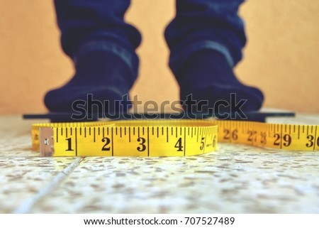 standing on a scale