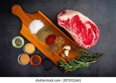 Standing Prime Rib Roast Ingredients: Uncooked Beef Rib Roast With Spices And Other Ingredients