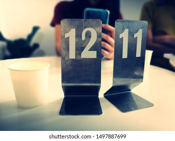 Standing Queue Or Waiting Number A Cafe Restaurant Table, Waiting Order Preparation, Made From Stainless Steel