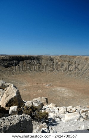 Standing at the Rim Looking Down into Meteor Crater in Arizona