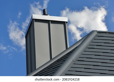 Standing Seam Metal Plated Chimney On A Tiled Roof