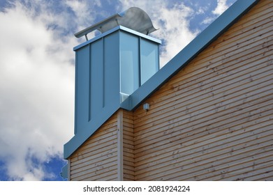 Standing Seam Metal Plated Chimney On A Tiled Roof