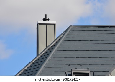 Standing Seam Metal Plated Chimney On A Tiled Roof