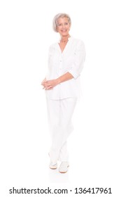 Standing Senior Woman In Front Of White Background