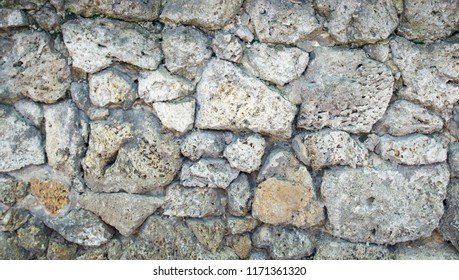 A standing stone wall. Stone background