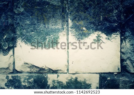 A standing stone wall. Stone background.