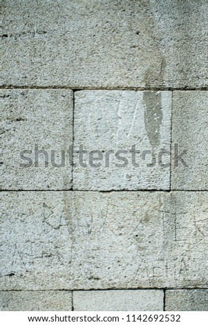 A standing stone wall. Stone background.