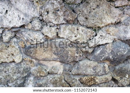A standing stone wall. Stone background