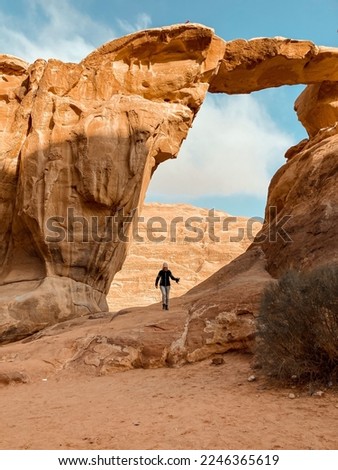 standing under an arch in wadi rum
