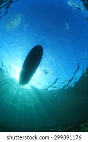Standup Paddle Board from beneath the sea surface