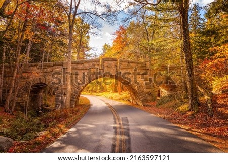 The Stanley Brook Bridge in the Acadia National PArk on a sunny fall day