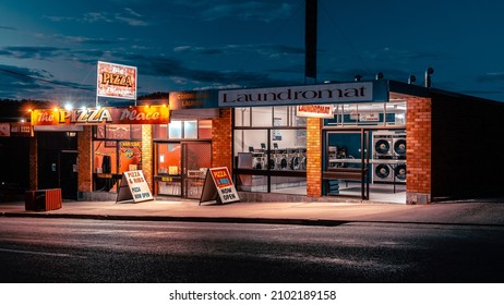 Stanthorpe, Queensland, Australia - Jan 4, 2022: Laundromat And Pizza Shop Illuminated At Night