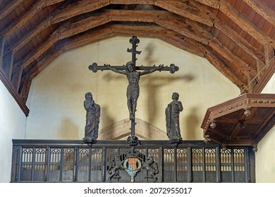 Stanton, Gloucestershire, UK. November 9th, 2021, The crucifixion of Jesus on the Rood screen and surrounding architecture designed by Sir Ninian Comper in 1915 in St Michael and All Angels church. 