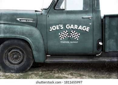 Stanton, Illinois, USA, April 2018 -Old Pickup Work Truck, Joe's Garage, Ford F 250, Round Fenders, Door, 1950s, Tires, Vintage, Antique, Classic