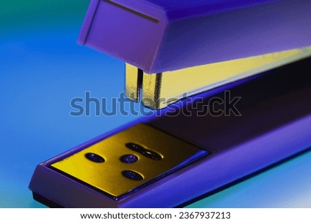 Stapler closeup in blue and yellow colors