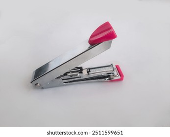 A stapler is a tool used to attach papers with metal staples