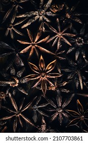 Star Among Stars. Close Up Of Star Anise From Above. Dark Moody Food Background Of Star Anise On Wooden Table