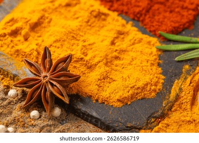 star anise close-up and spices turmeric, paprika, cardamom, nutmeg, and allspice.