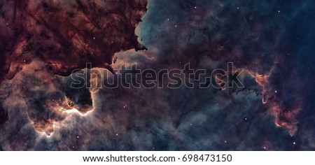 Star Birth in the Carina Nebula or Grand Nebula. Large bright nebula that has within its boundaries several related open clusters of stars. Retouched image. Elements of this image furnished by NASA.