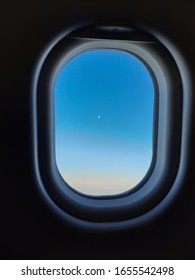 The Star In Blue Sky Looking Through Plane Window