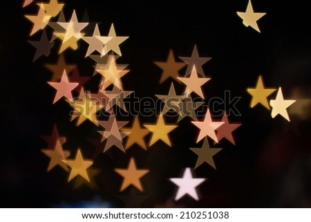 It is Star bokeh lights on black background.
