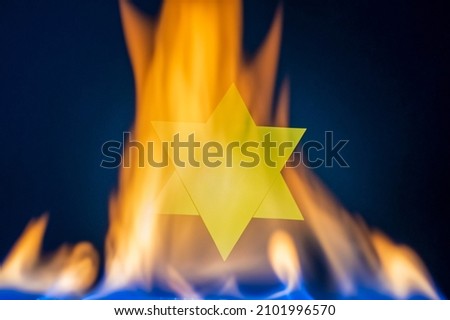 Star of David in the flame. In memory of the victims of the Holocaust and genocide.