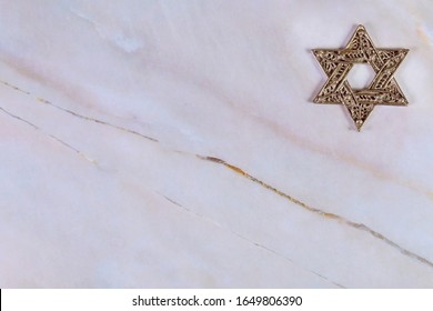 Star Of David, Jewish Symbol On White Granite Background.