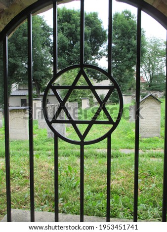 Star of David on metal gate of Jewish cemetery