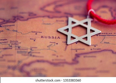 Star of David on Russia (world map). Repatriation from Russia to Israel concept. - Shutterstock ID 1353383360