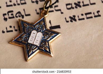 Star David pendant on old paper page background