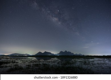 A Star At Nigh Sky With Cloudy At Night Time