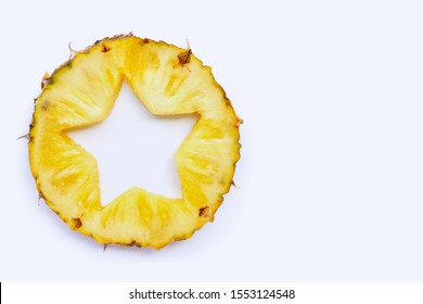 Star Shape Cut Off In Fresh Pineapple Slice On White Background With Copy Space