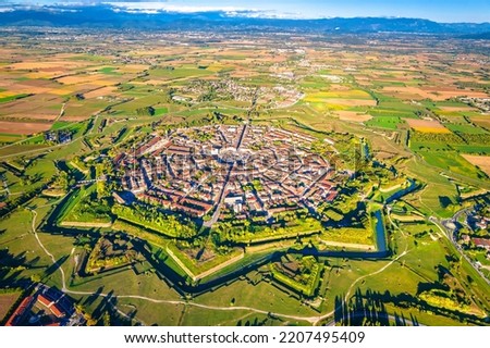 Star shape town of Palmanova defense walls and trenches aerial panoramic view, UNESCO world heritage site in Friuli Venezia Giulia region of northern Italy