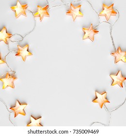 Star Shaped Christmas Lights Frame. Flat Lay, Top View 