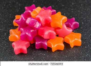 Star Shaped Jelly Candy On A Black Background