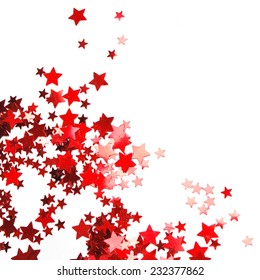 Star Shaped Red Confetti On White Background. Festive Background