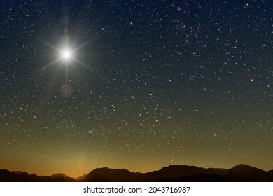 The Star Shines Over The Manger Of Christmas Of Jesus Christ.