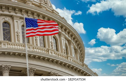 The star spangled banner American flag flies proudly in front of the US capitol building in Washington DC with blue cloudy sky background - Shutterstock ID 1829147534