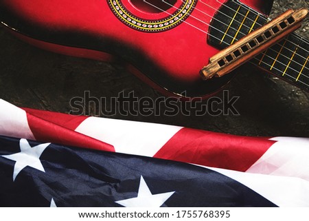 Star spangled banner, guitar and harmonica. Musical instrument and flag of the United States of America