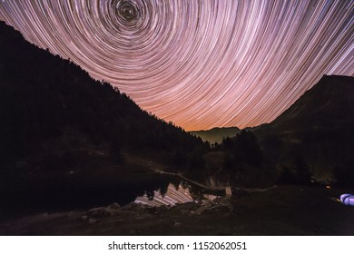 Star Trail Over Mountains Reflecting In Altitude Lake