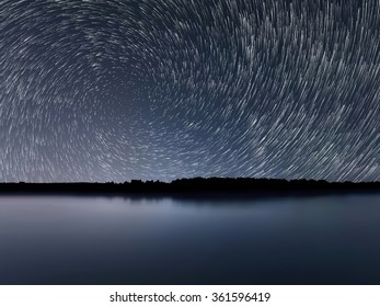 Star Trails, Beautiful Blue Night reflection.Clear night sky
Star trails over the river - Shutterstock ID 361596419
