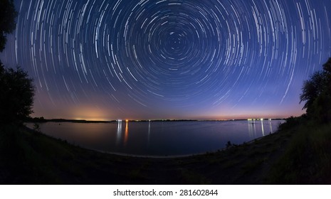 Star trails at the lake side - Shutterstock ID 281602844