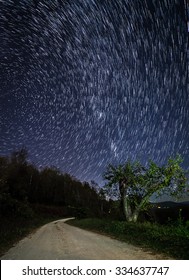 Star Trails Over The Apple Orchard In The Blue Ridge Mountains Of North Carolina At Night.