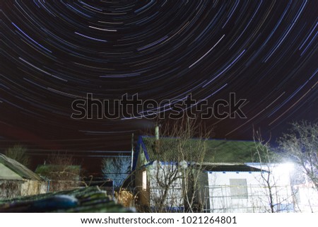 Star trails over the village house