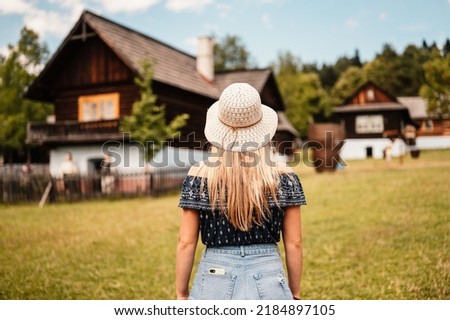 Stara Lubovna Castle and an open air folk museum, Slovakia Young woman tourist traveler. Slovakia travel cultural heritage
