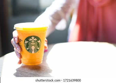 A Starbucks cup of cold beverage made o passion fruits in Bali , Indonesia. November 2019
