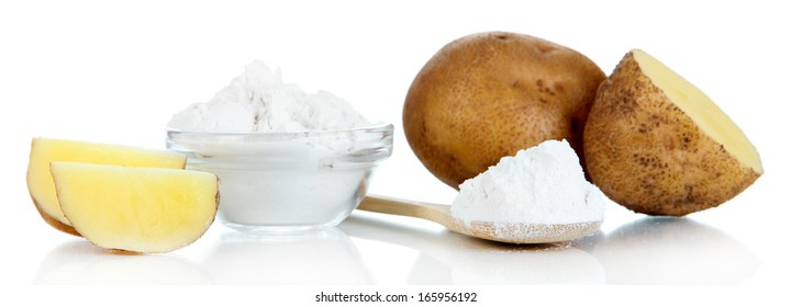 Starch in spoon with potatoes isolated on white