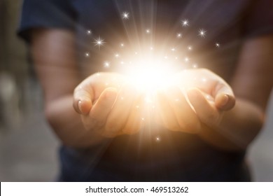 
Stardust And Magic In Woman Hands On Dark Background